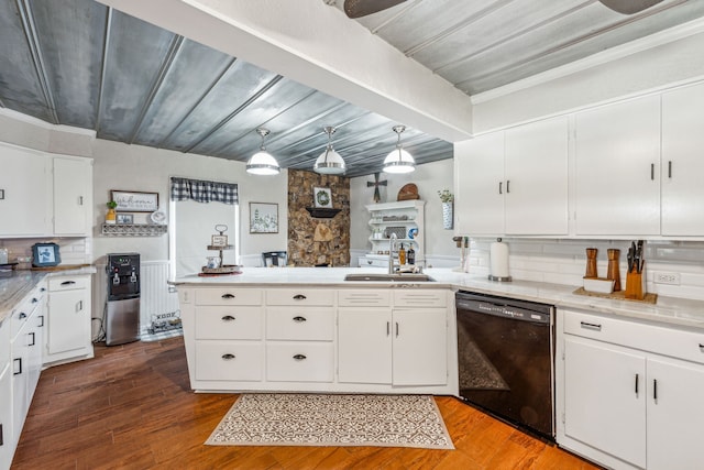 kitchen featuring sink, decorative light fixtures, dishwasher, and white cabinets