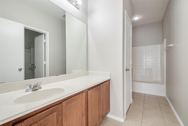 full bath with tile patterned flooring, shower / bathing tub combination, vanity, and baseboards