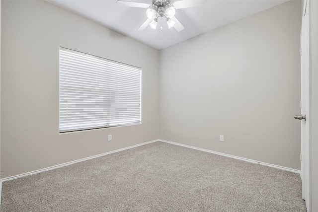 empty room featuring baseboards, ceiling fan, and carpet flooring