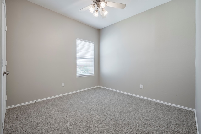 empty room featuring ceiling fan and carpet flooring