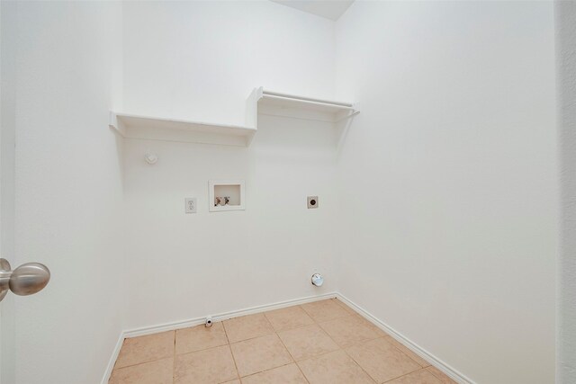 laundry area with light tile patterned floors, hookup for an electric dryer, washer hookup, and hookup for a gas dryer