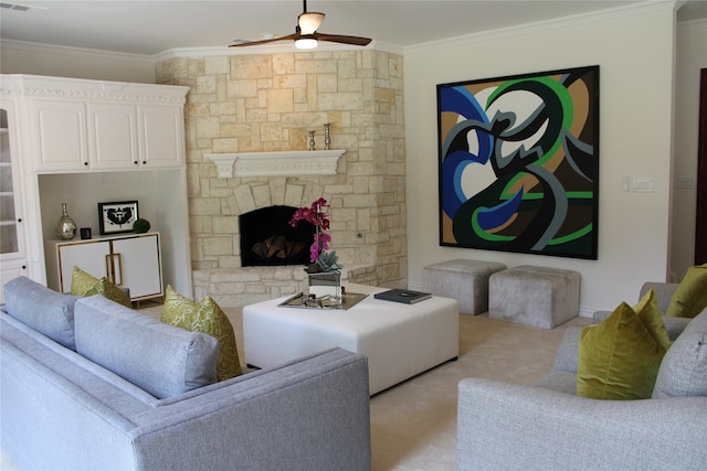 carpeted living room with a fireplace, ornamental molding, and ceiling fan