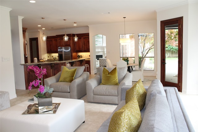 carpeted living room with crown molding