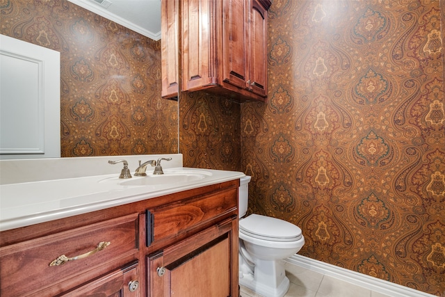 bathroom featuring tile patterned floors, vanity, ornamental molding, and toilet