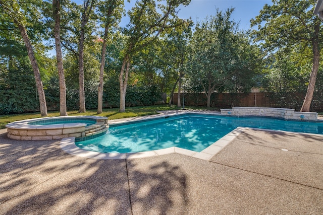 view of swimming pool with an in ground hot tub and a patio area