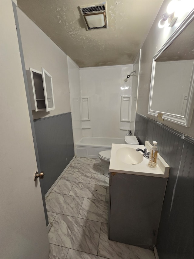 full bathroom featuring bathing tub / shower combination, vanity, tile patterned flooring, and toilet