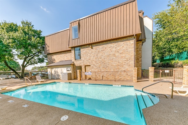 view of pool featuring a patio