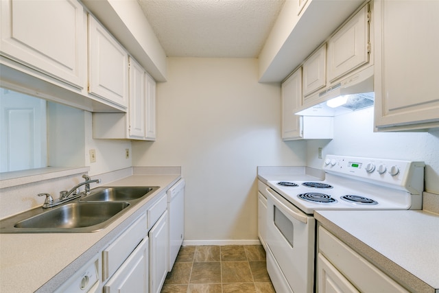 kitchen featuring a textured ceiling, white appliances, sink, and white cabinets