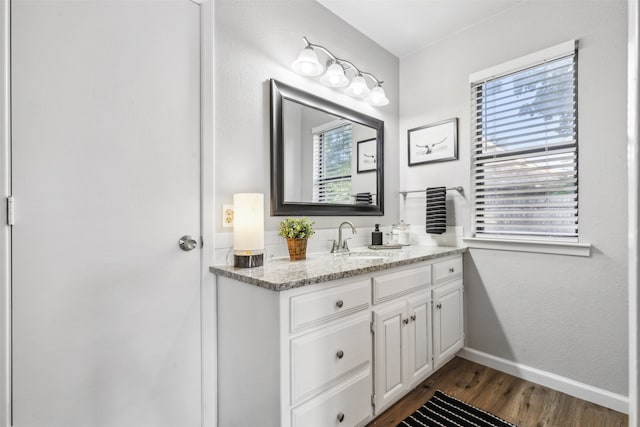 bathroom featuring wood-type flooring and vanity