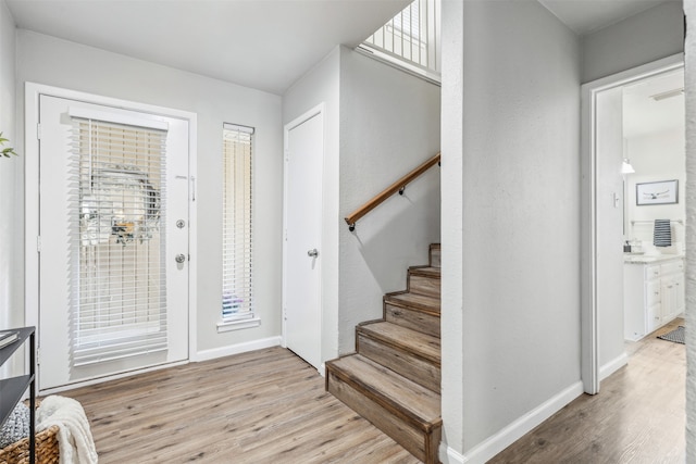 foyer with light hardwood / wood-style flooring