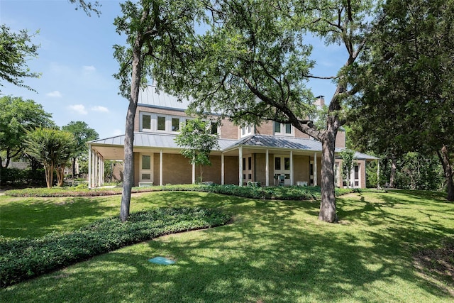 view of front facade with a porch and a front yard