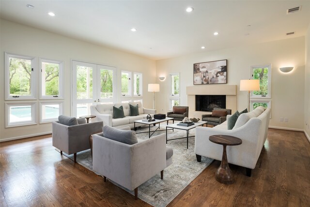 living room featuring dark wood-type flooring and french doors