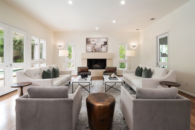 living room featuring hardwood / wood-style flooring and french doors