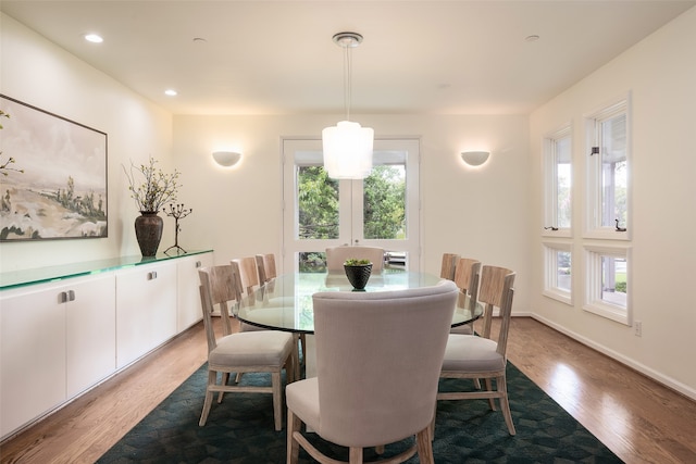 dining area with hardwood / wood-style floors