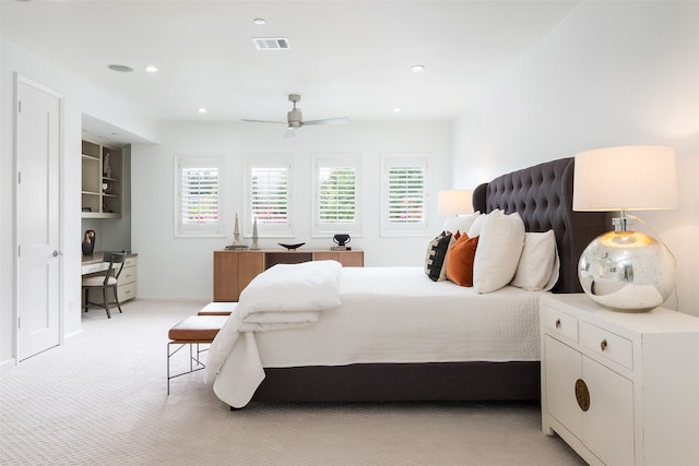 bedroom featuring light carpet and ceiling fan