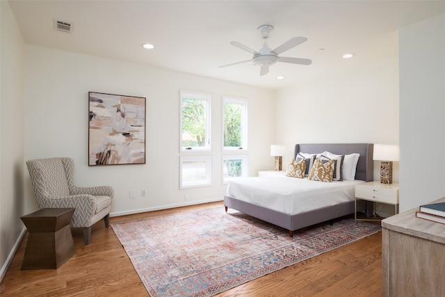 bedroom featuring ceiling fan and hardwood / wood-style flooring