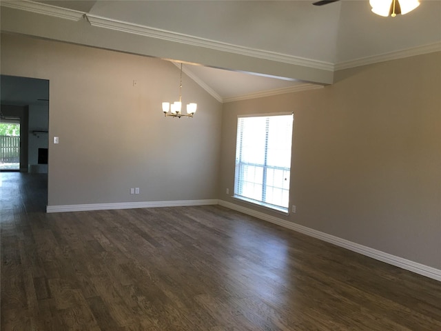 spare room with dark wood-type flooring, vaulted ceiling, and plenty of natural light