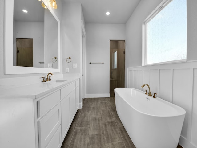 bathroom featuring vanity and shower with separate bathtub