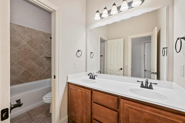 full bathroom with tile patterned floors, toilet, vanity, and tiled shower / bath