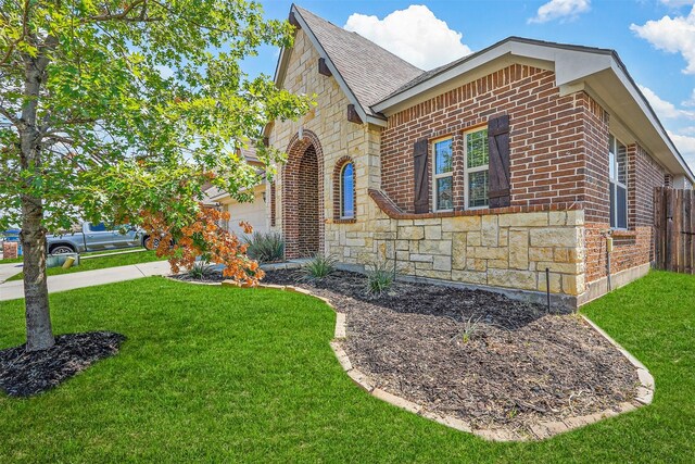 view of property exterior with a garage and a lawn