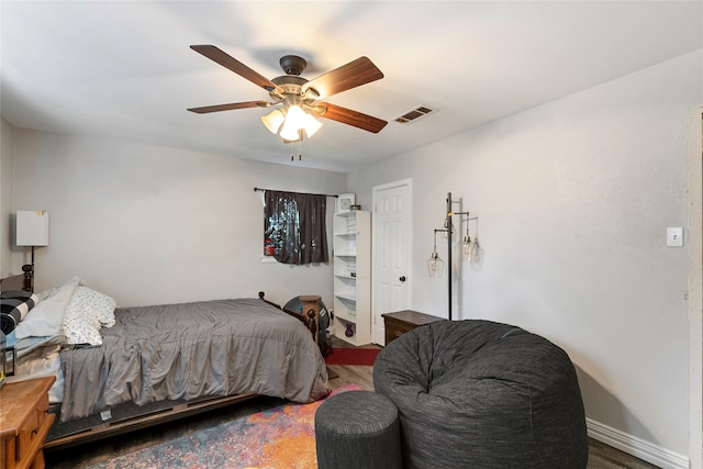 bedroom with ceiling fan and hardwood / wood-style floors