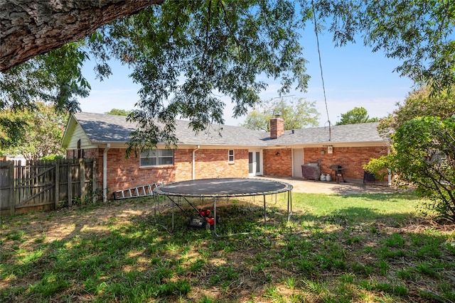 view of yard with a trampoline