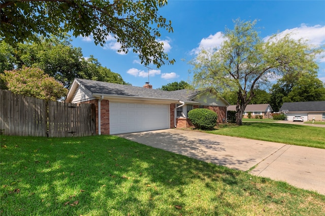 ranch-style house featuring a garage and a front lawn