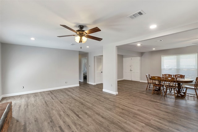 unfurnished dining area with hardwood / wood-style flooring and ceiling fan