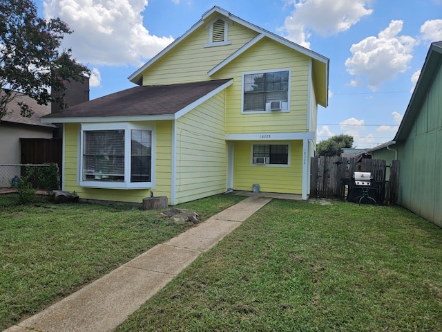 back of house with a yard