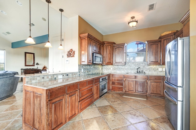 kitchen featuring backsplash, pendant lighting, sink, stainless steel appliances, and light stone counters