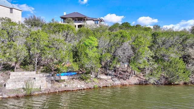 birds eye view of property with a water view