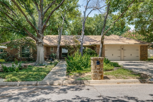 ranch-style home featuring a garage