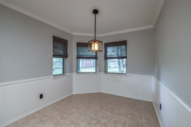 unfurnished room with ornamental molding and a wealth of natural light