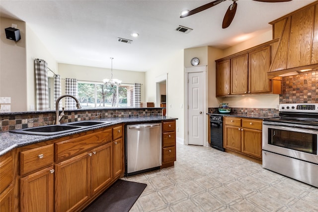 kitchen featuring sink, stainless steel appliances, tasteful backsplash, dark stone countertops, and custom exhaust hood