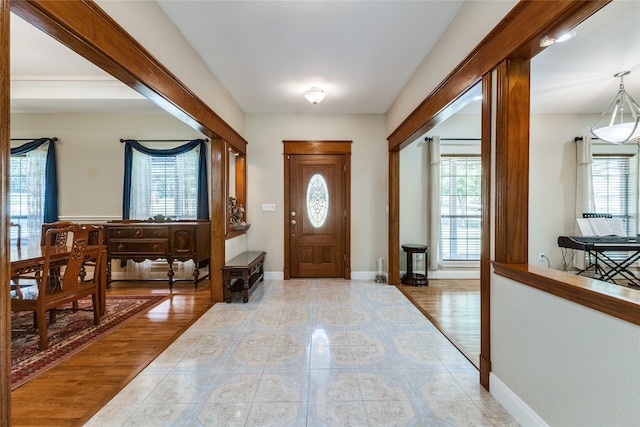 foyer entrance featuring a healthy amount of sunlight and light hardwood / wood-style floors