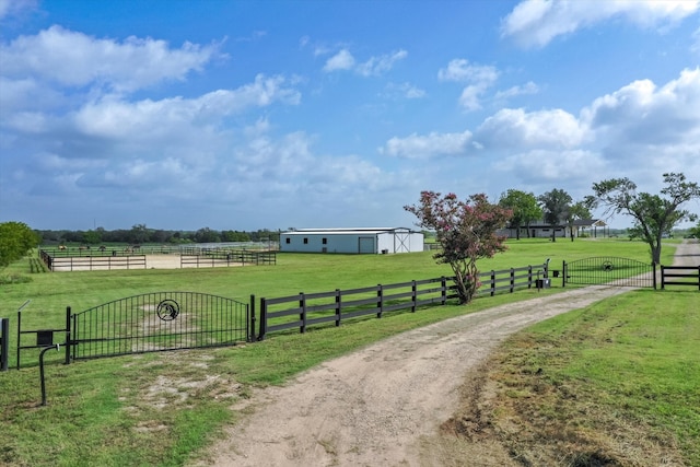 view of home's community featuring a yard and a rural view