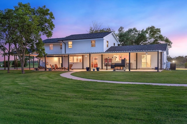1320 Murrah Ln, Kaufman, TX 75142 - back of house at dusk featuring a patio and a yard