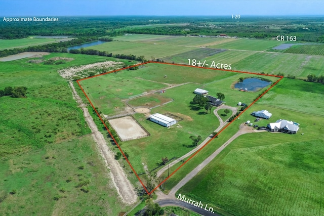 bird's eye view featuring a water view and a rural view