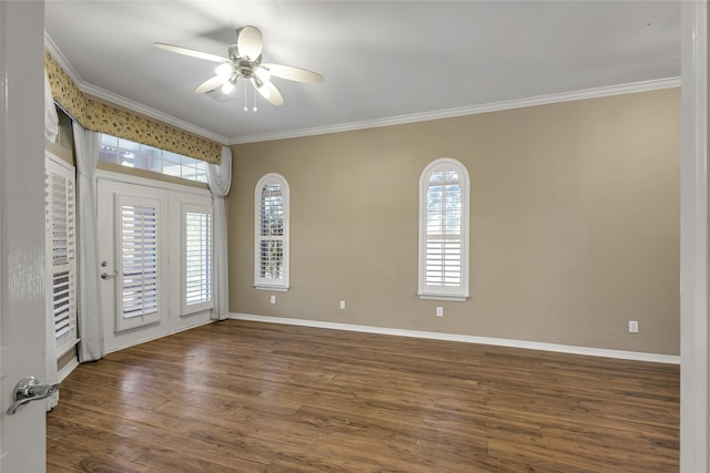 unfurnished room featuring dark wood-type flooring, ceiling fan, and ornamental molding