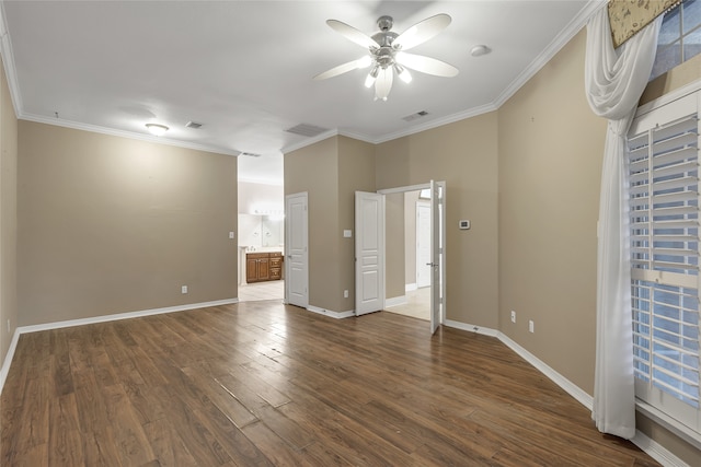 empty room featuring crown molding, ceiling fan, and hardwood / wood-style floors