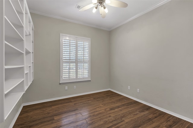 spare room featuring dark wood-type flooring, ceiling fan, and ornamental molding