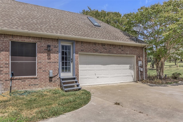 view of side of property with a garage