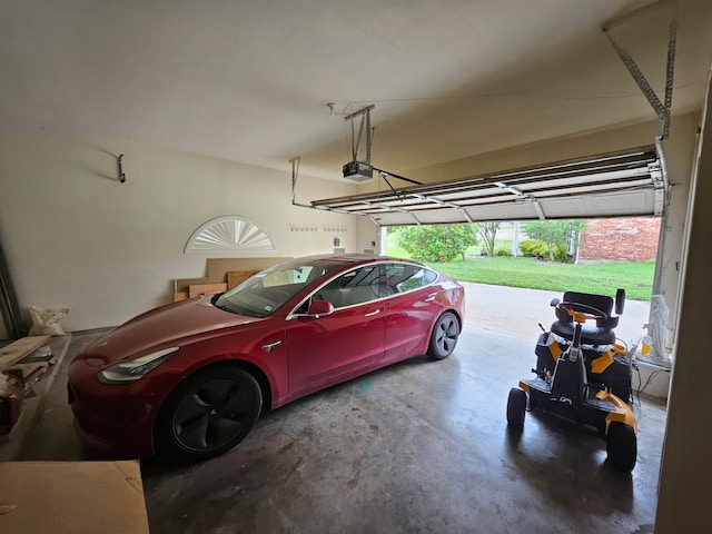 garage featuring a garage door opener and a carport