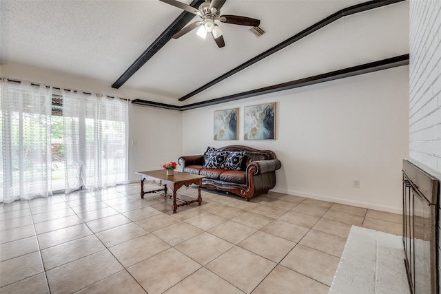 tiled living room featuring a textured ceiling, lofted ceiling with beams, and ceiling fan