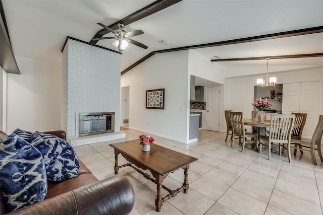 tiled living room with ceiling fan with notable chandelier, lofted ceiling with beams, a brick fireplace, and a textured ceiling