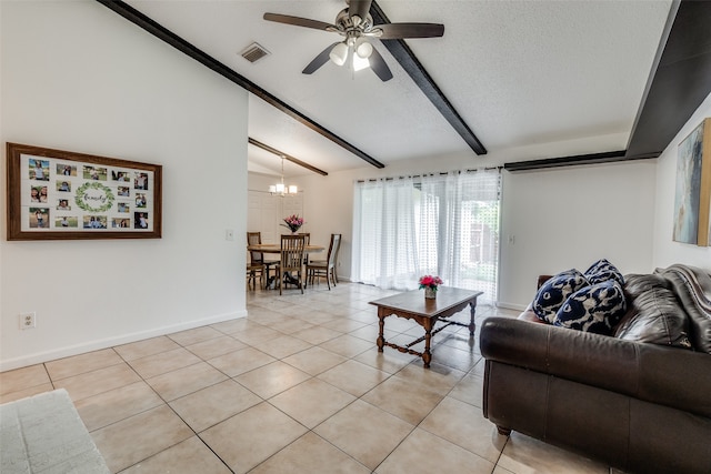 tiled living room featuring a textured ceiling, ceiling fan with notable chandelier, and beam ceiling