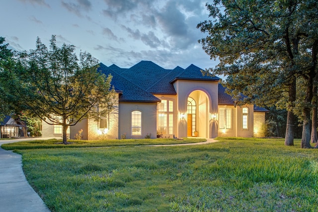 view of front of home with a yard