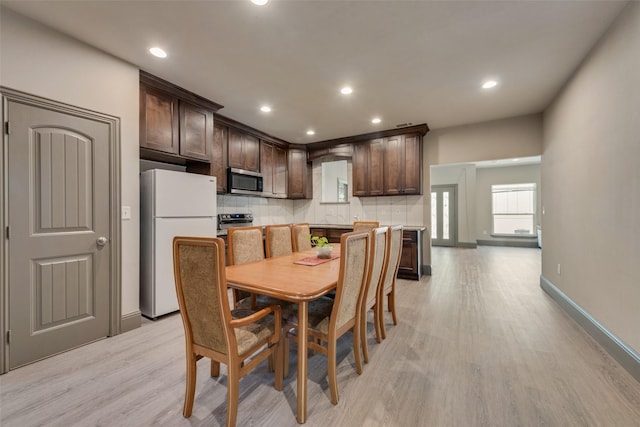 dining space featuring light hardwood / wood-style flooring