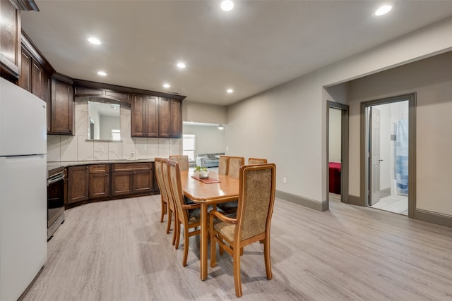 dining area with light hardwood / wood-style floors