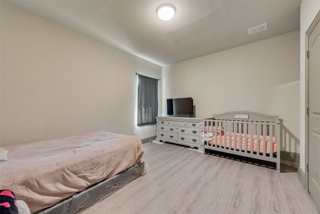 bedroom featuring light hardwood / wood-style flooring